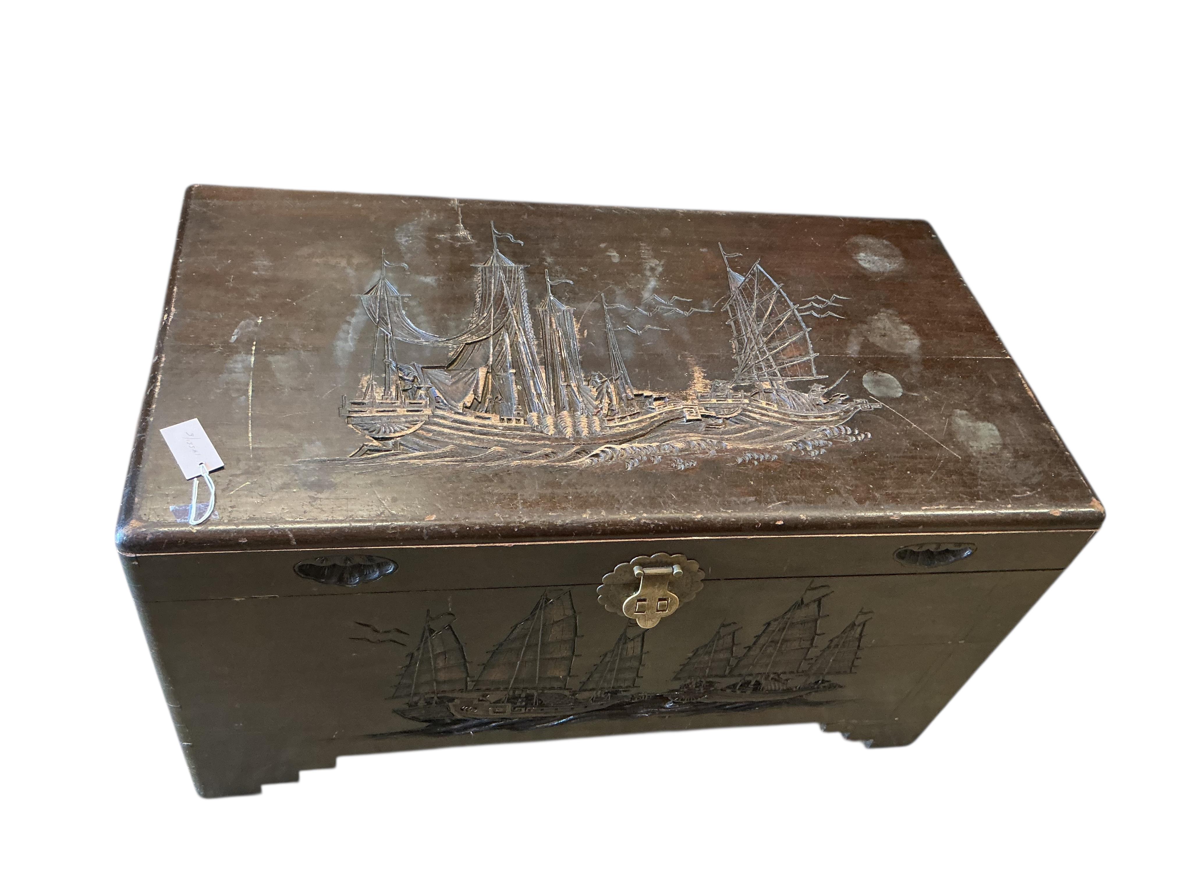 A Chinese carved camphorwood trunk, width 100cm, depth 54cm, height 56cm.
